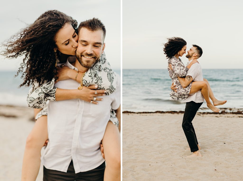 Woman kissing and piggy backing on man on the beach in front of the ocean