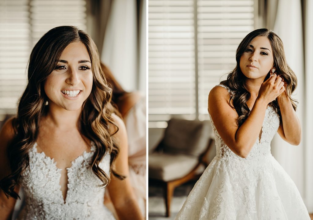 Bride getting ready putting on earrings with dress on