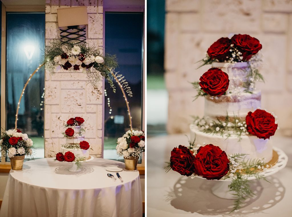 Detail shot of Red rode wedding cake with greenery
