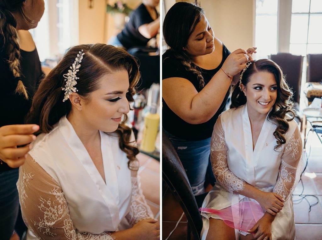 Bride having hair done by stylist getting ready