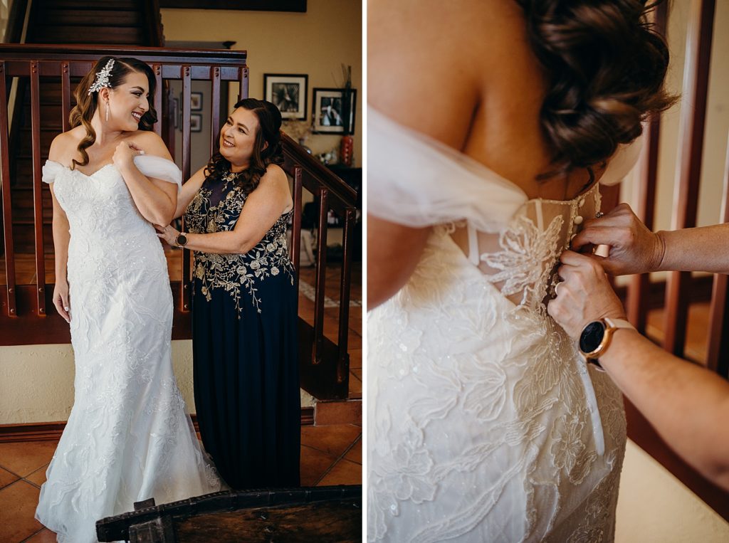 Mother helping Bride button up Wedding Dress while getting ready